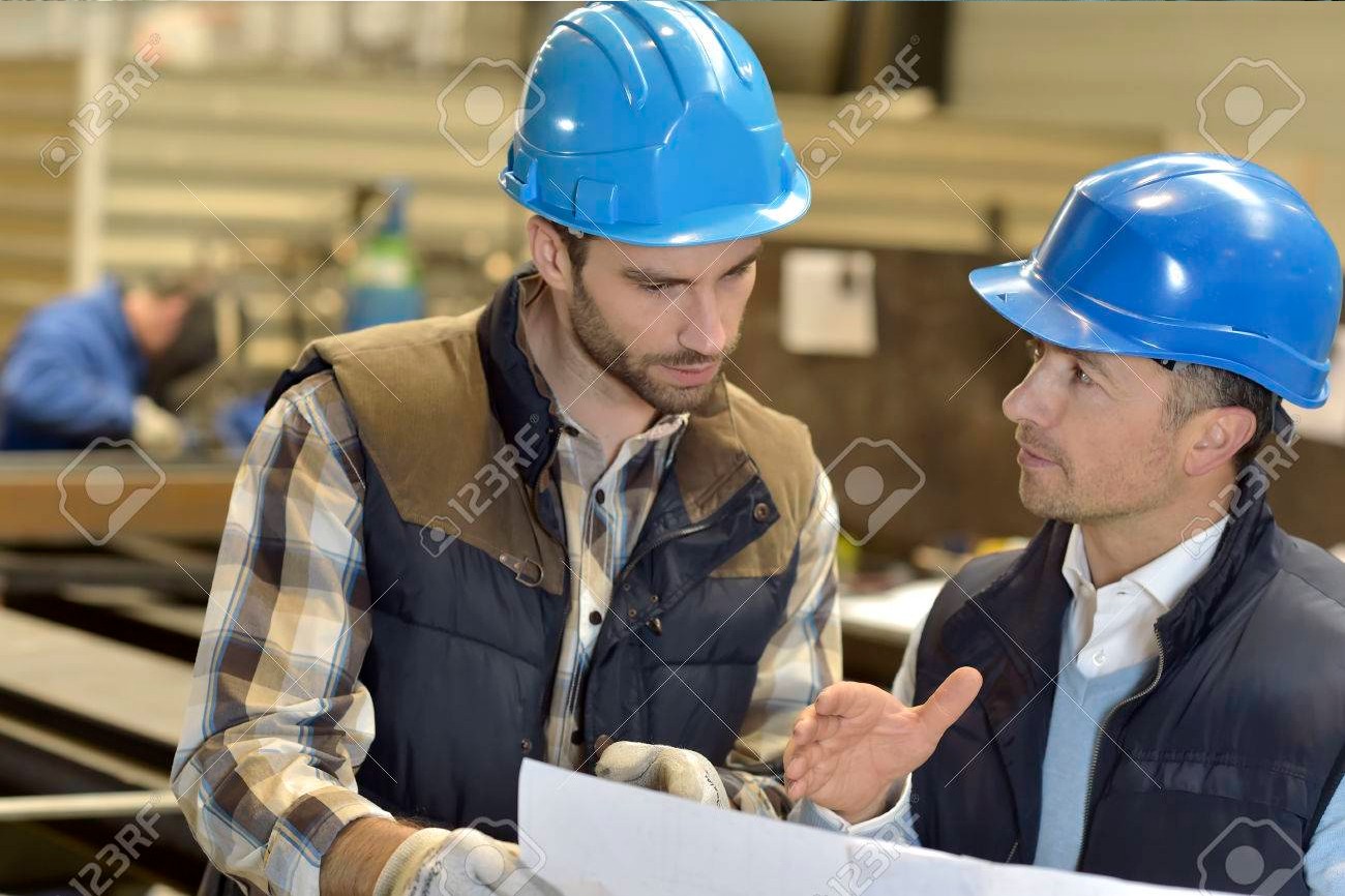 engineer-with-mechanical-worker-checking-on-production