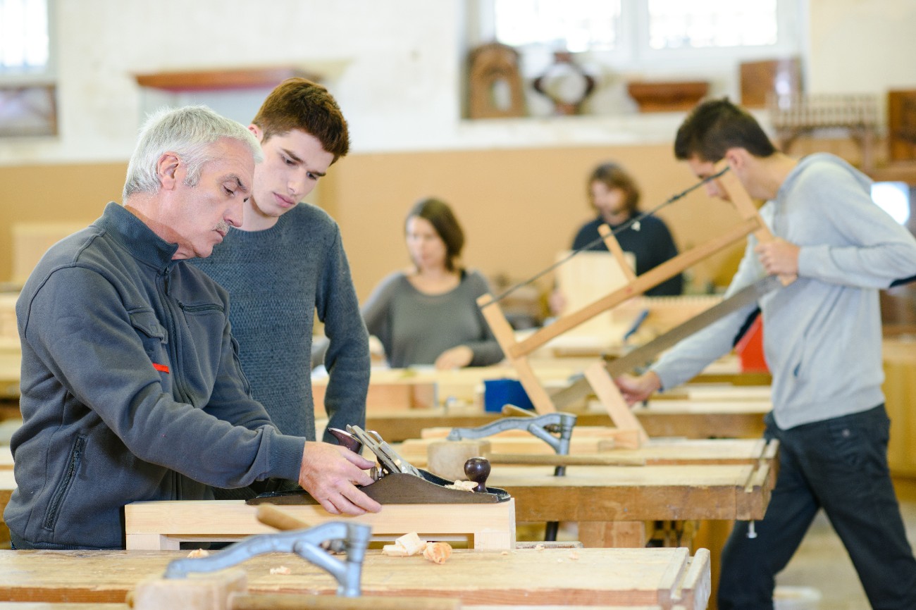 student and teacher in carpentry class