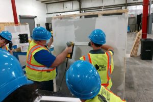 Three People Working With a Drywall | Construction Management